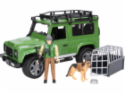 Land Rover Defender s figurkou lesníka a psa